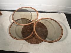 Adrian Pearsall MODERNIST TRIPLE TIER WICKER AND AMBER GLASS SWIVELING COFFEE TABLE - 2809884