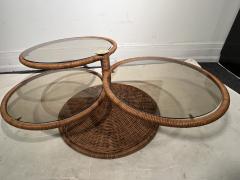 Adrian Pearsall MODERNIST TRIPLE TIER WICKER AND AMBER GLASS SWIVELING COFFEE TABLE - 2809886