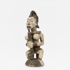 African Southern Nigeria Mid Century Carved Painted Wood Seated Female Anjenu - 4695174