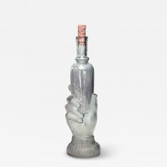 American Victorian glass decanter of hand holding small bottle - 4734565