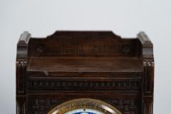 An Anglo Japanese Carved Oak Mantel Clock with Hand Painted Blue Floral Dial - 4189020