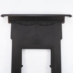 An Arts Crafts Art Nouveau Cast Iron Fireplace with Stylized Floral Details - 4189349