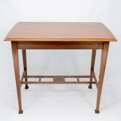 An Arts Crafts Glasgow School walnut side table w moulded subtly curving edge - 4236742