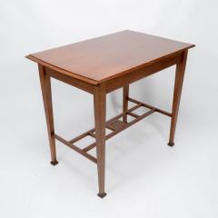 An Arts Crafts Glasgow School walnut side table w moulded subtly curving edge - 4236743