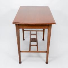 An Arts Crafts Glasgow School walnut side table w moulded subtly curving edge - 4236744