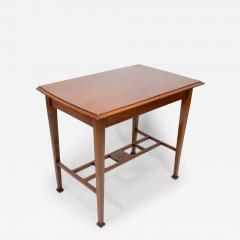 An Arts Crafts Glasgow School walnut side table w moulded subtly curving edge - 4237631