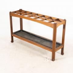 An Arts Crafts Oak Stick Umbrella Stand with Fourteen Sections - 4192799