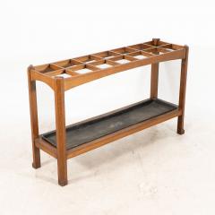 An Arts Crafts Oak Stick Umbrella Stand with Fourteen Sections - 4192803