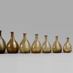 An Exceptional Set of 13 Graduated Blown Chestnut Bottles - 307791