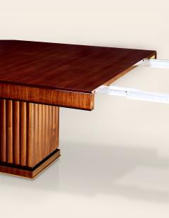 An Extendable Dining Table with Fluted Base by Iliad Design - 453796