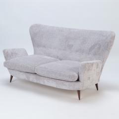 An Italian vintage wingback drop arm upholstered settee  - 2630649