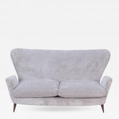 An Italian vintage wingback drop arm upholstered settee  - 2634947
