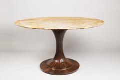 An Oval Pedestal Table by ILIAD Design - 703051