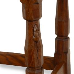 An adze cut Mouseman oak four legged stool - 3779623