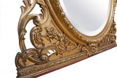 An attractive Continental round carved gilt wood mantel mirror - 3632359