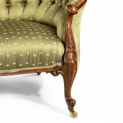 An elaborate Victorian shaped walnut sofa - 1846410