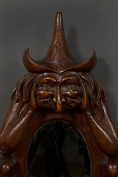 An oval arts and crafts period carved oak scrying mirror in the form of a witch - 4217708