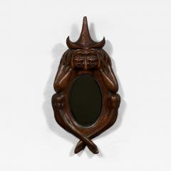 An oval arts and crafts period carved oak scrying mirror in the form of a witch - 4218441