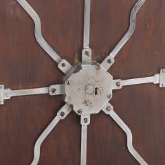 Antique steel lock mechanism mounted on a wooden board  - 4293232