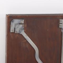 Antique steel lock mechanism mounted on a wooden board  - 4293234