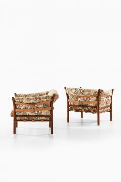 Arne Norell Pair of Indra Easy Chairs in Beech Brass Leather by Arne Norell 1970s - 4687904