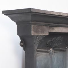 Arts Crafts cast iron fireplace with curved sides stylized floral decoration - 4189372