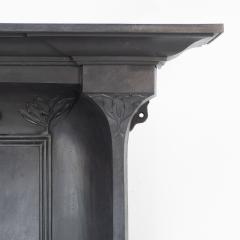 Arts Crafts cast iron fireplace with curved sides stylized floral decoration - 4189375