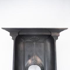 Arts Crafts cast iron fireplace with curved sides stylized floral decoration - 4189376
