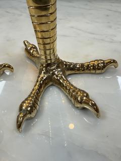 Brass candle holders designed in the shape of bird talons - 4299342