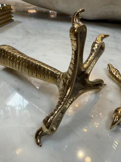 Brass candle holders designed in the shape of bird talons - 4299348