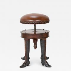Bronze Four Legged Adjustable Revolving Stool with Leather Upholstered Seat Bronze Four Legged Adjustable Revolving Stool with Leather Upholstered Seat