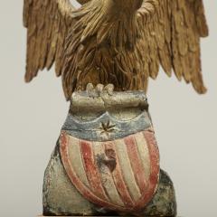 CARVED EAGLE WITH SWEPT BACK WINGS PERCHED ON A ROCK WITH SHIELD - 3018590