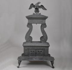 CAST IRON TWO COLUMN PARLOR STOVE WITH EAGLE FINIA - 831864