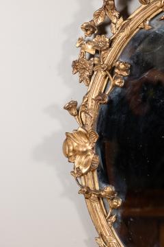 Carved French Giltwood Oval Mirror with Urn Crest Floral Garlands Circa 1870 - 3818732