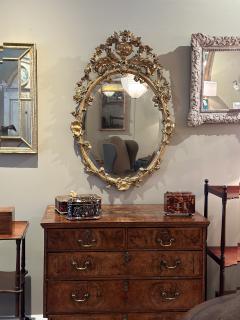 Carved French Giltwood Oval Mirror with Urn Crest Floral Garlands Circa 1870 - 3818733