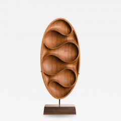 Carved wood almond shaped sculpture and base  - 3307071