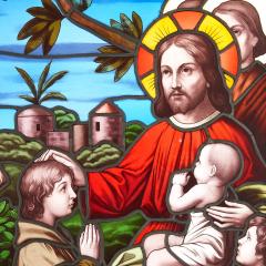 Christian stained glass window of Christ blessing children - 2337699