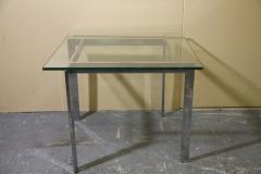 Chrome and glass side table in the manner of Milo Baughman - 3392513