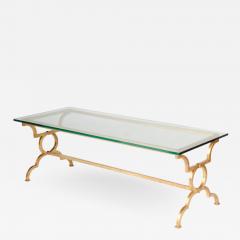 Coffee table framed with ring motif legs and a single stretcher - 1791141