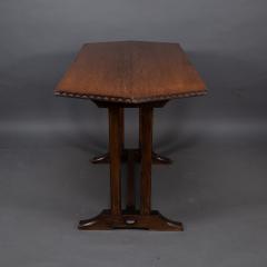 Cotswold style oak refectory dining or library table with carved chevron details - 4192941