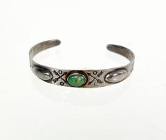 Dine Navajo bracelet with repousse center turquoise stone and stamped designs - 2799917