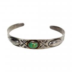 Dine Navajo bracelet with repousse center turquoise stone and stamped designs - 2804372