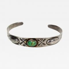 Dine Navajo bracelet with repousse center turquoise stone and stamped designs - 2804373