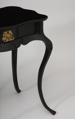 Dramatic ebonized side table with bat drawer pull - 1357623