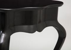 Dramatic ebonized side table with bat drawer pull - 1357627