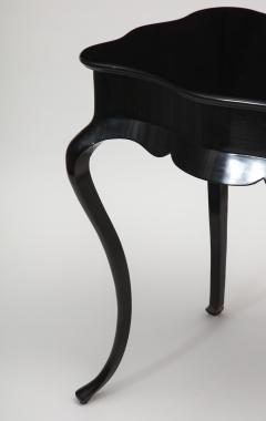 Dramatic ebonized side table with bat drawer pull - 1357628