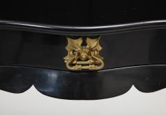 Dramatic ebonized side table with bat drawer pull - 1357629