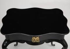 Dramatic ebonized side table with bat drawer pull - 1357630