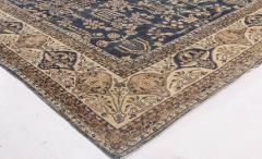 Early 20th Century Persian Kirman Navy Blue and Camel Wool Rug - 2447944