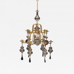 Erik H glund A gilt wrought iron and glass chandelier by Erik Hoglund for Boda  - 3794982